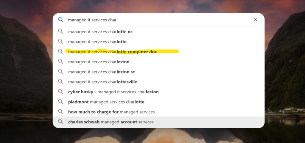 Search bar with auto-fill suggestions for managed IT services in Charlotte, highlighting Computer Doc.