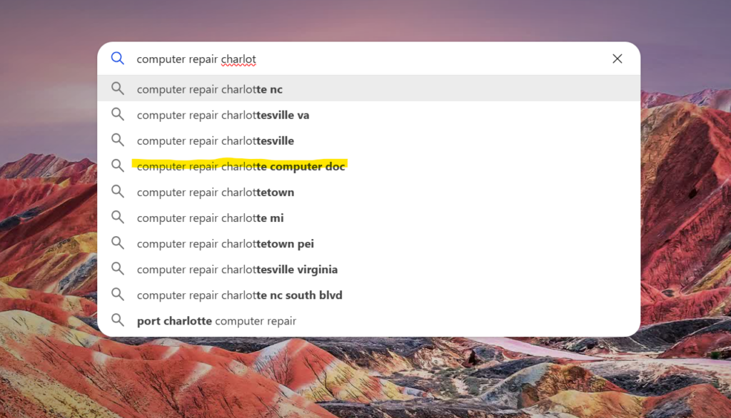 Search bar with auto-fill suggestions for computer repair in Charlotte, highlighting 'computer doc'.