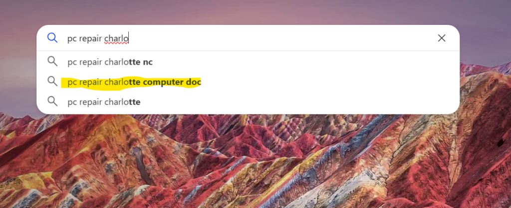 Search bar with auto-fill suggestions for pc repair in Charlotte, highlighting computer doc.